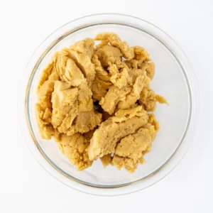 Close up of cake dough crumbled into a fine, moist texture showing the ideal consistency for rolling Halloween cake truffles