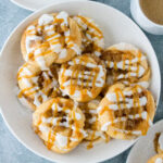 Easy caramel apple Danish made with refrigerated crescent sheet dough, cream cheese filling, cinnamon apples, icing, and caramel drizzle.