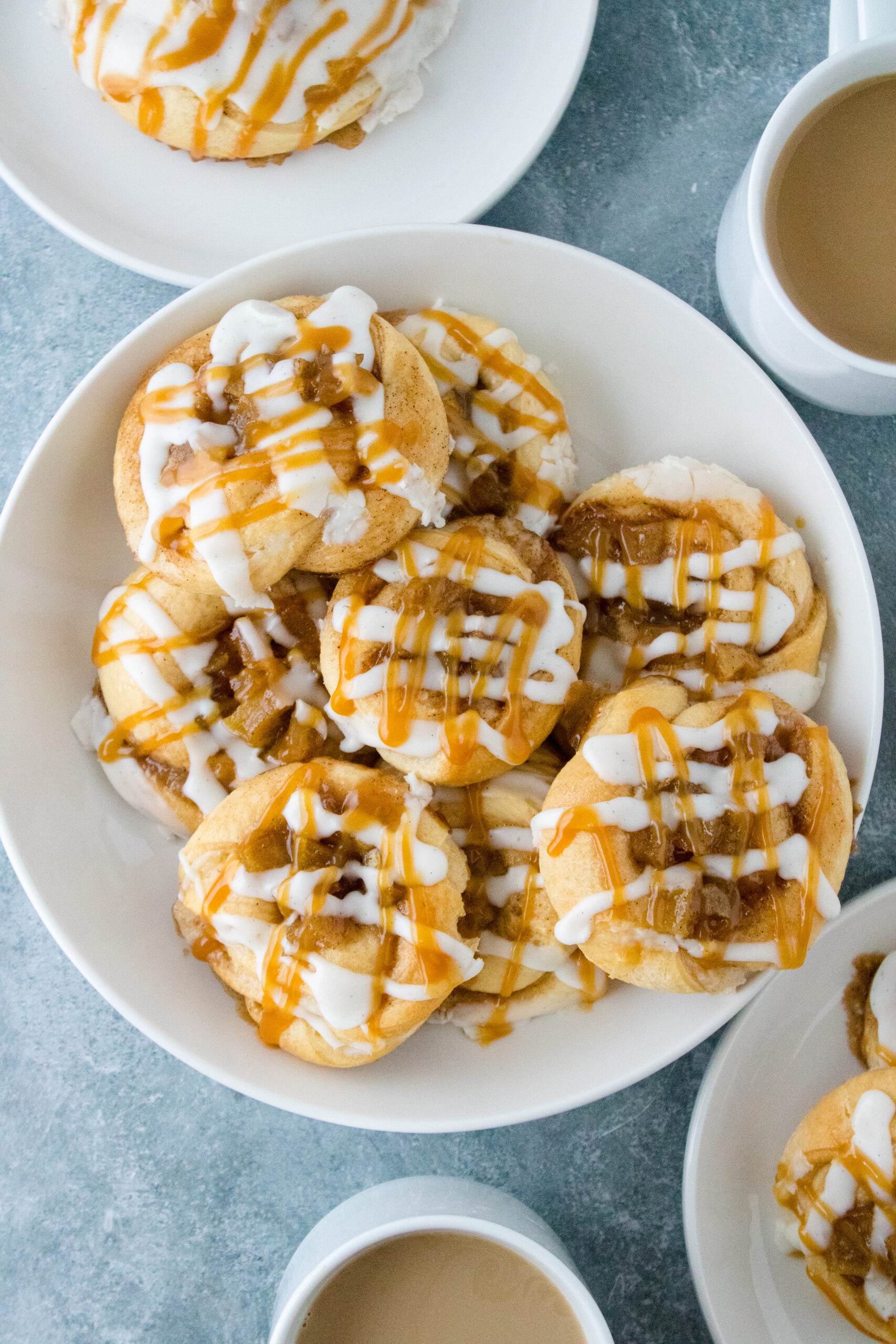 Easy caramel apple Danish made with refrigerated crescent sheet dough, cream cheese filling, cinnamon apples, icing, and caramel drizzle.