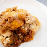 Cake Mix Peach Cobbler at www.theaffordablefoodie.com