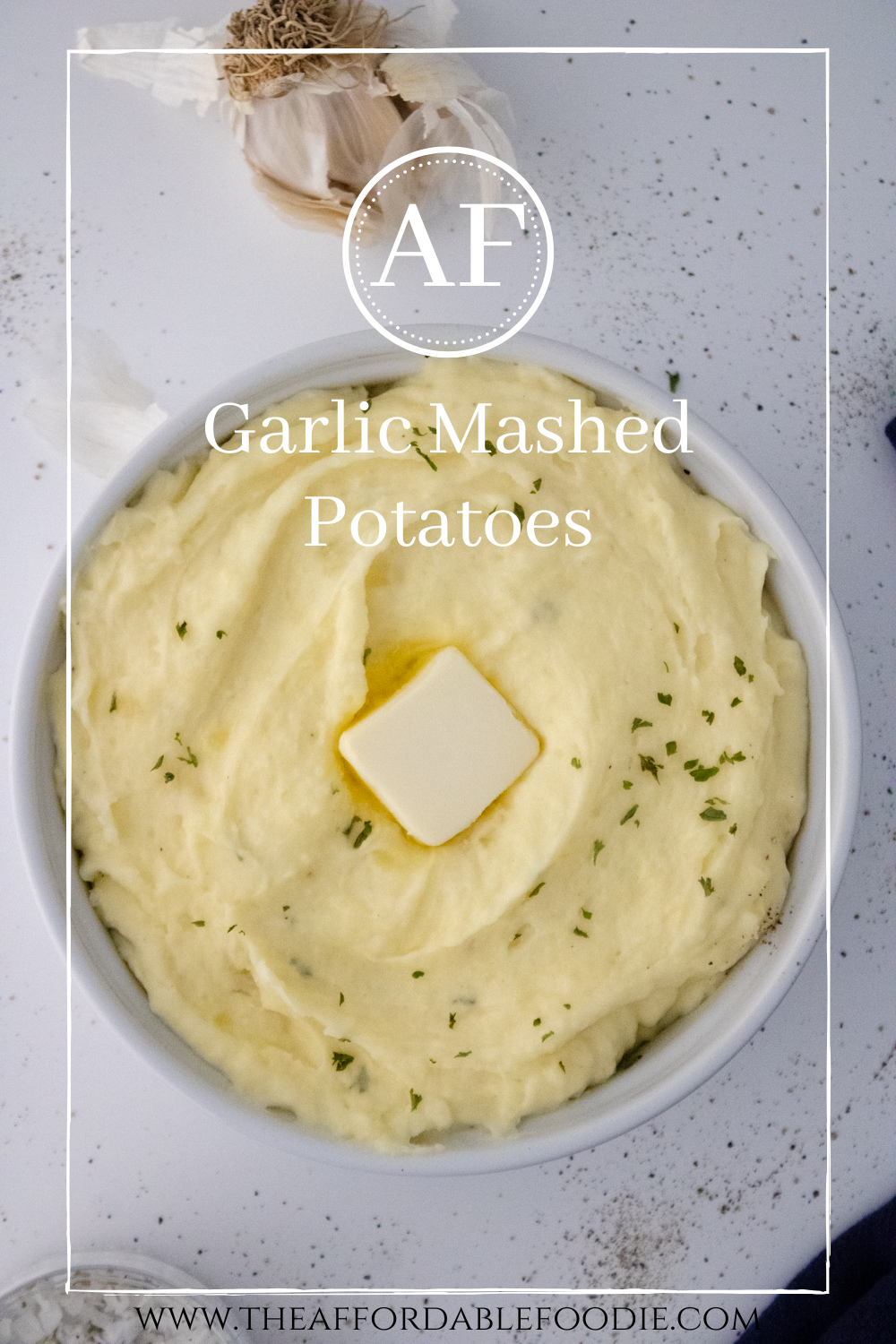 Creamy garlic mashed potatoes whipped with butter and cream, showing a smooth, fluffy texture and rich garlic flavor. It's the ultimate comfort side dish.