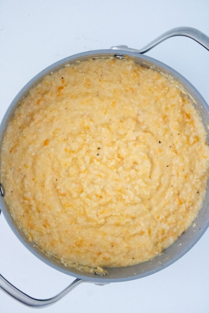 Creamy sweet potato grits after the ingredients have been fully combined