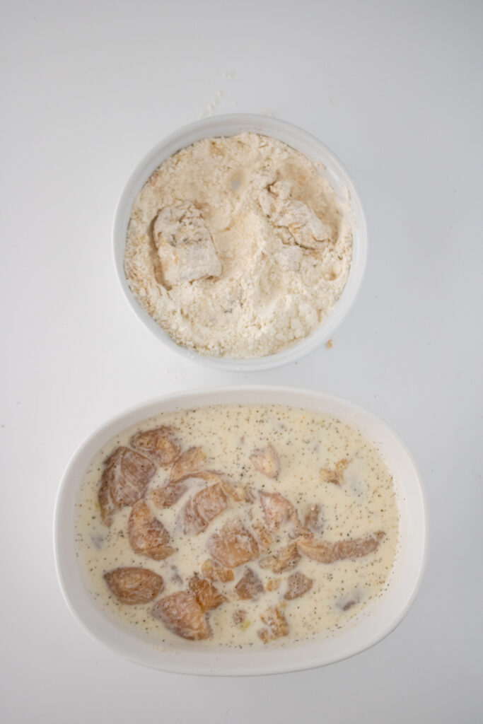 Copy Cat Chick-fil-A Chicken Nuggets uncooked marinating on white background