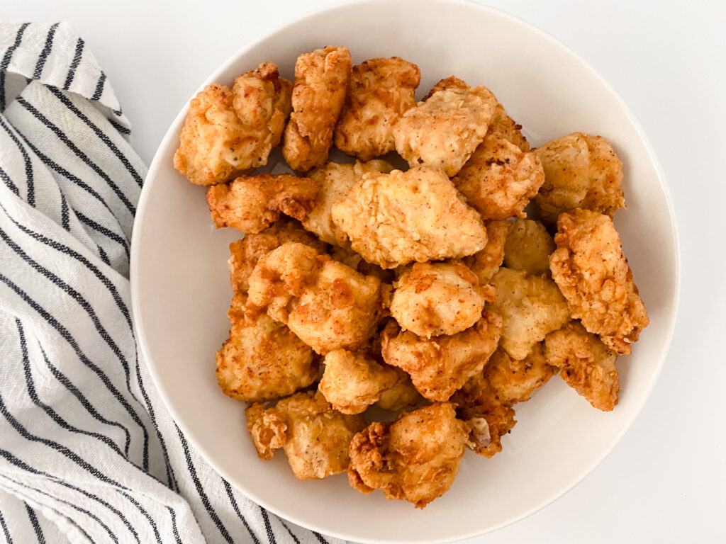 Copy Cat Chick-fil-A Chicken Nuggets on white backdrop with white and black towel
