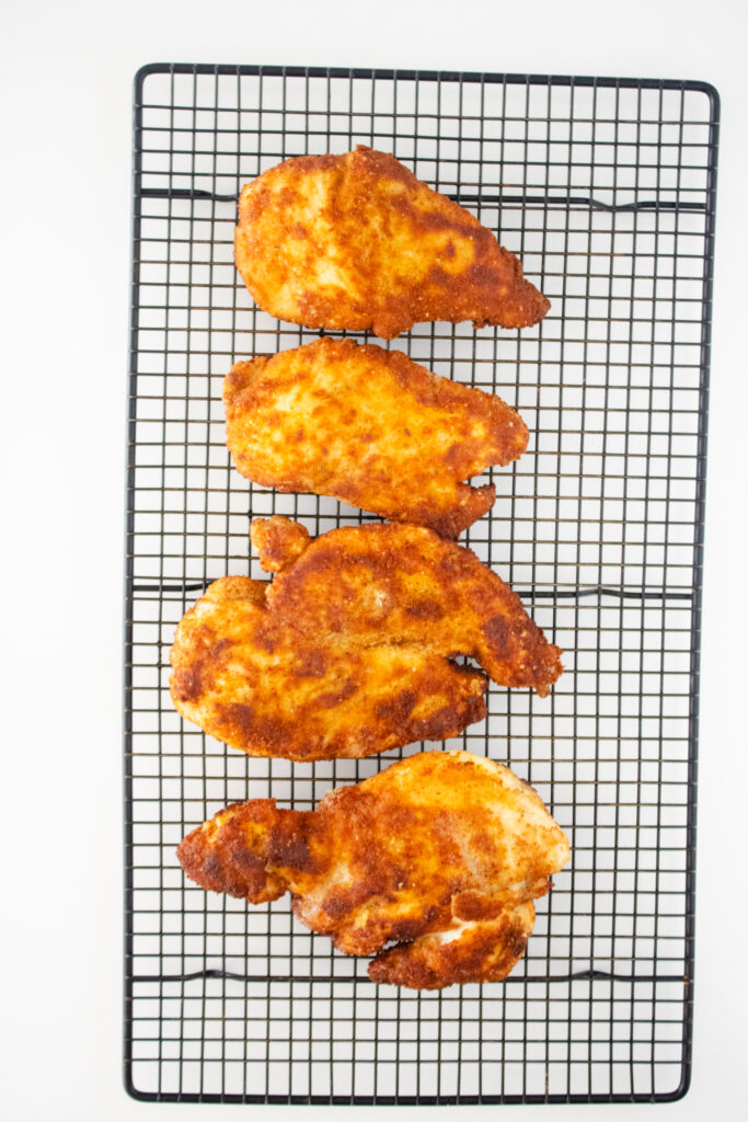 chicken cutlets on wire cooling rack
