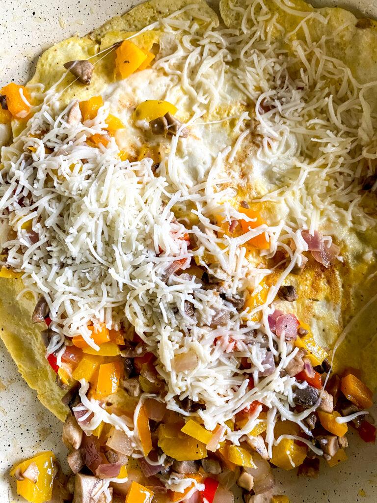 breakfast quesadilla ingredients in a pan