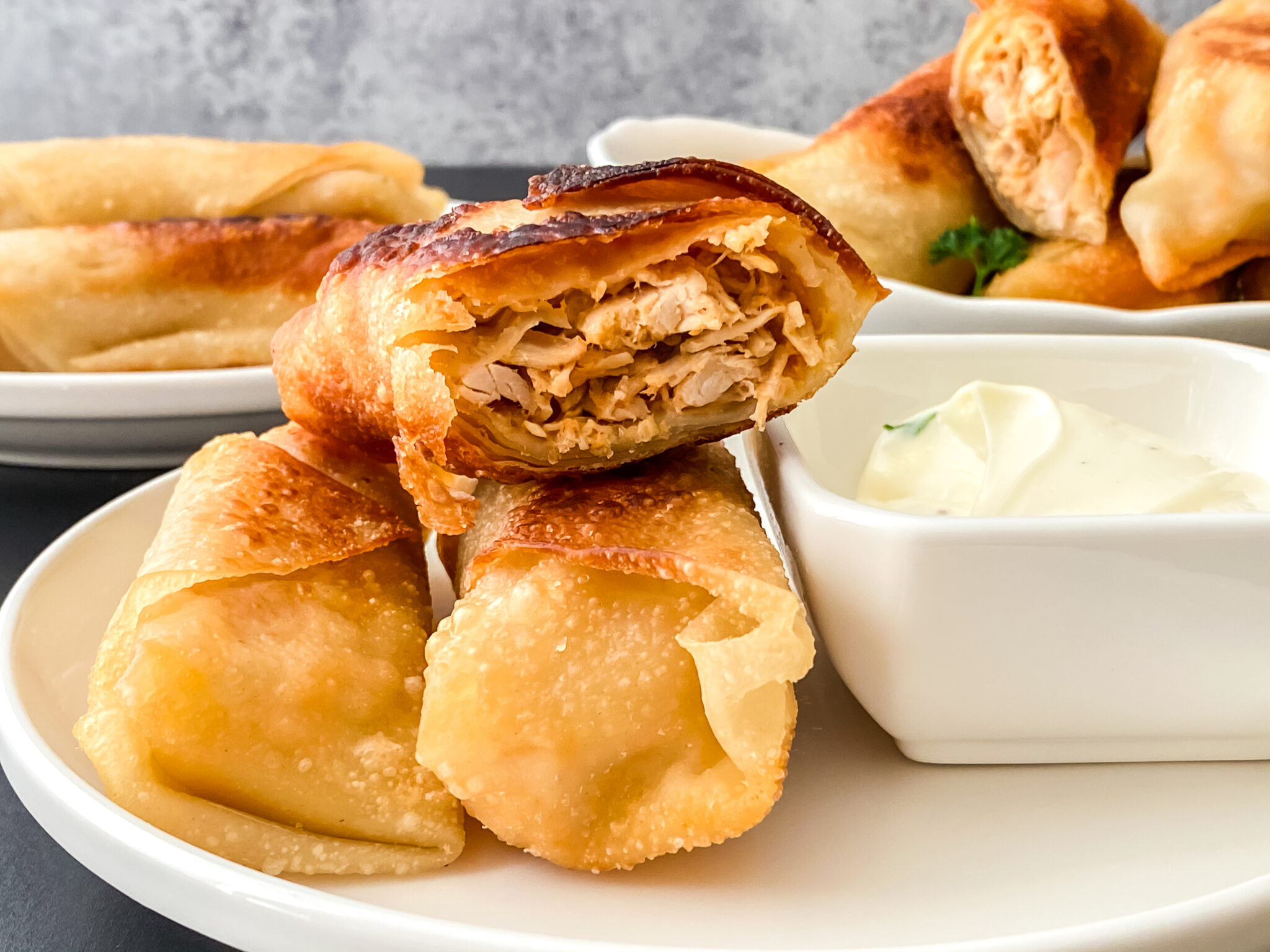 Crispy buffalo chicken egg rolls filled with shredded chicken and served with ranch dipping sauce.