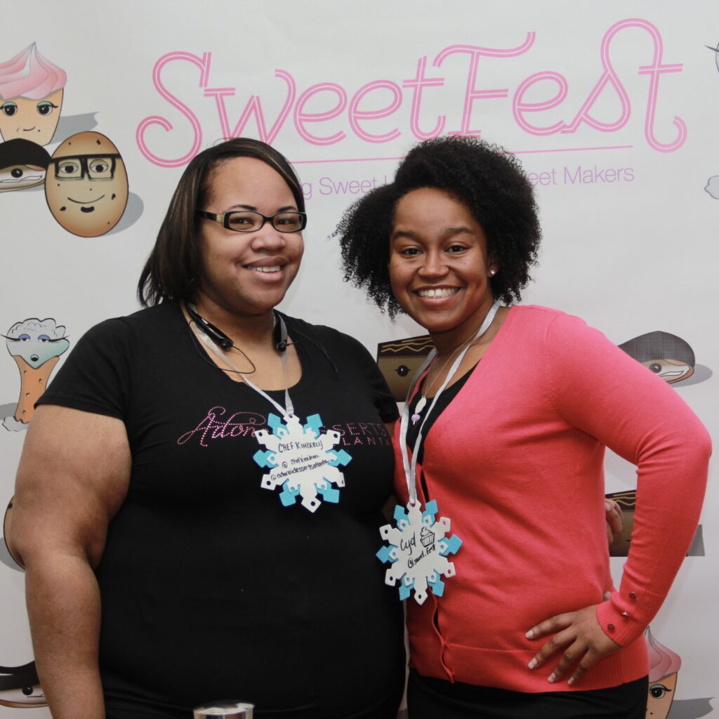 Image of Cyd Mitchell Hodges of Sweet Fest, a food and finance professional, and Chef Kimberly Houston founder of The Affordable Foodie, meeting for the first time at a conference hosted by Sweet Fest back in 2014.
