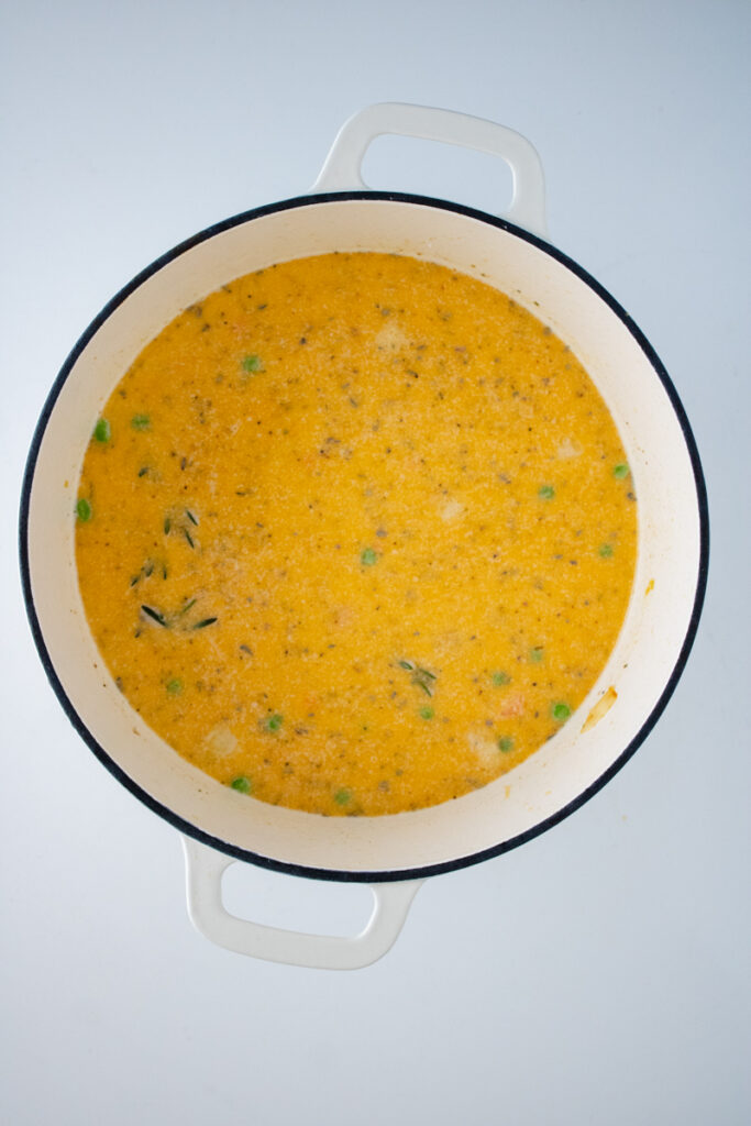Frozen peas and carrots and seasonings stirred into the creamy broth for chicken and dumplings with biscuit mix.