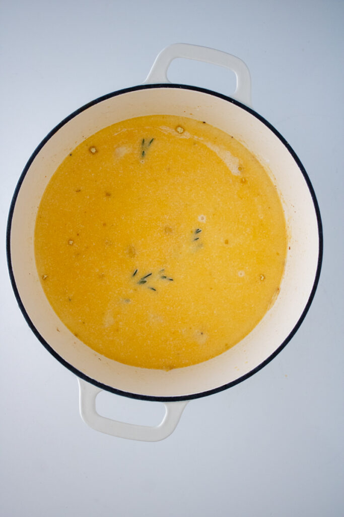 Heavy cream stirred into the broth for chicken and dumplings with biscuit mix, creating a smooth and creamy base.